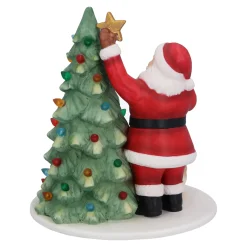 Standfiguren-Weihnachtsmann beim Baum schmücken